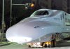 In this 2008 file photo, the engine of an N700 bullet train is transported through a street in Fukuoka, Japan.