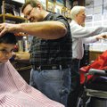 FREE STYLE 
Carson Jackson, 4, left, and brother Garrett, 5, get haircuts by Vic Bradford and Gary ...