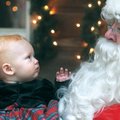 SANTA BABY
Seven-month-old Lauren Williams of Springdale, inspects Santa on Saturday while having h...