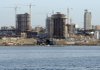 Construction continues on towers in Luanda, Angola, last week. OPEC ministers are meeting today in the African capital.