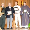 Army Spc. Robert Kearney, from left, makes presentations of plaques Sunday in gratitude to Knights o...