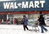 Shoppers struggle with their cart Saturday in Philadelphia, where nearly two feet of snow fell, disrupting Christmas shopping.
