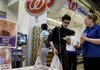 Tami Iuliucci (right), a Walgreen employee, talks to customer Craig Perlmutter of Brooklyn about the Walgreen flu-shot program at a Manhattan store in September.