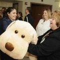 Cadel Staff Sgt. Abby Talarski, left, gives Barbara Stillings, director of women and children’s serv...