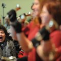 Felicia Stott of Fayetteville reacts with joy to the playing of a portion of Handel’s “Messiah” by m...