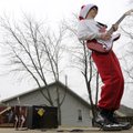 Durgan Maxey performs a solo jam Tuesday on a Fender guitar while working to attract customers in fr...