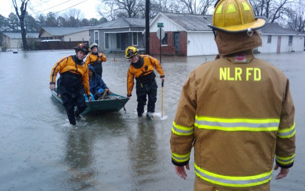 firemen-rescuing-people-from-flooded-homes-near-17th-and-maple-streets-in-north-little-rock-thursday