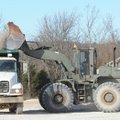 Washington County workers load gravel on Dec. 17 into a dump truck at the county’s Maintenance and O...
