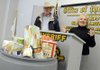 Marge Wolf, right, director of the Northwest Arkansas Food Bank, thanks the Benton County Sheriff’s Office and partner agencies Wednesday in Bentonville following Sheriff Keith Ferguson’s announcement of an 8,371-pounds-of-goods donation to the Northwest Arkansas Food Bank. The donation surpassed the Sheriff’s Office’s 2008 donation by 3,656 pounds.

