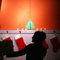 With the lights dimmed and the walls decorated for the season, Youth Services librarian Shay Brooks ...