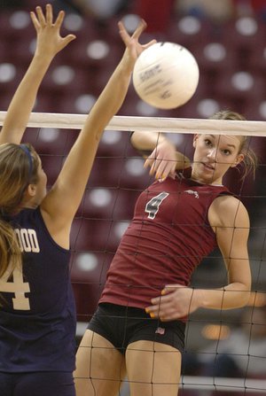 Siloam Springs’ Hannah Allison hits past Greenwood’s Keeley Treece during the Class 5A state volleyball championship on Oct. 31 in the Arkansas State University Convocation Center at Jonesboro. Siloam Springs won 25-22, 27-25, 25-20 to claim its sixth consecutive title.
