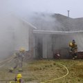 HOUSE FIRE
Springdale firefighters work the scene of a fire at 1642 Onyx Ave. in Springdale. Neighb...