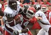  Arkansas defender Jerry Franklin brings down Miss. State running back Anthony Dixon during the first quarter  at War Memorial Stadium in Little Rock.
