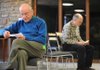 Quakers Peter Marchant, left, and David Schoen ponder the definition of a series of “spiritual gifts” during an exercise conducted by Marianne Lockhard for the Fayetteville Friends Meeting (Quakers) on Dec. 20.