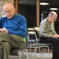 Quakers Peter Marchant, left, and David Schoen ponder the definition of a series of “spiritual gifts...