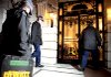 London police enter a building Saturday during a search connected with the attempted terrorist attack on a Northwest Airlines flight on Friday.