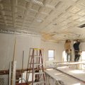 Workers finish installing a metal ceiling Dec. 10 in the balcony of the historic Washington County C...