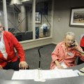 Helen Hammond, middle, Stephen Keane, left, and Adam Wilcox, right, volunteer at the information des...
