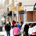 THE DAY AFTER
After-Christmas bargain hunters and gift exchangers began arriving on a cold Satruday...