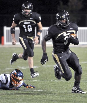 Bentonville running back Courtney Haskell scores a touchdown against Rogers Heritage on Oct. 9 in Tiger Stadium in Bentonville. Haskell is the All-Northwest Arkansas Big 6 Newcomer of the Year.
