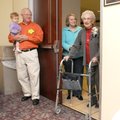 Ola Fox walks into a surprise party for her 100th birthday at the Jones Center in Springdale on Dec....