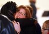 Cindy Wise, wife of Salvation Army Maj. Philip Wise, is comforted by a woman attending the Sunday church service at the Salvation Army Corps Community Center in North Little Rock. Philip Wise, 40, was shot and killed at the center Christmas Eve.