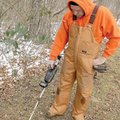 Robert Rook searches for treasure Sunday in Park Springs Park in Bentonville. Rook received the meta...