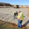 Washington County workers construct the pad for a planned training facility for the Washington Count...
