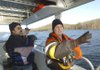 Terry Elder, right, volunteer coordinator at Hobbs State Park-Conservation Area, leads an eagle tour at Beaver Lake on Dec. 20. The park has a new 24-passenger pontoon boat and offers lake tours to see eagles on Wednesday, Saturday and Sunday.
