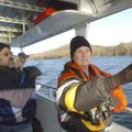 Terry Elder, right, volunteer coordinator at Hobbs State Park-Conservation Area, leads an eagle tour...