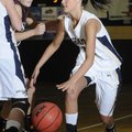 Shiloh Christian’s Meagan Henley, right, dribbles during Monday’s game against Siloam Springs in Spr...