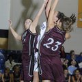 Siloam Springs’ Laken Grigg, left, and Rachel Hill, right, defend as Shiloh Christian’s Meagan Henle...