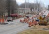 Traffic moves Wednesday along Arkansas 102 in the construction area between Bentonville and Centerton.