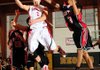 Farmington’s Evan Yochum, center, goes up for a shot under pressure from Springfield (Mo.) Central defender Tomari Fewell during Monday’s game in the Neosho Holiday Classic in Neosho, Mo.