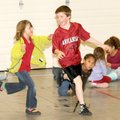 Kristen Babbitt, 6, tags Josh Johnson, 9, while an already tagged Rachel Mansfield, 6, right, looks ...
