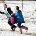 Elizabeth Boone (left), 10, and Cassidy Vanhook, 9, both of West Fork, carry their sled back up the ...