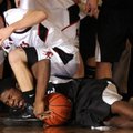 Bentonville’s Will Worthey fights for a loose ball with McDonald County (Mo.) guard Sy Morris during...