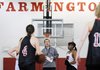 Farmington girls basketball coach Brad Johnson instructs his players during practice Tuesday in Farmington.