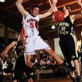 Rogers Heritage’s Anibal Avila is fouled on his way to the basket by Neosho (Mo.) forward Corey Cran...