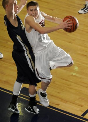 Siloam Springs junior Kyle Teague, right, takes a shot as Shiloh Christian sophomore Taylor Thompson defends Tuesday in the second half of the Har-Ber Holiday Basketball Tournament in Springdale. Teague had 40 points in the Panthers’ 63-53 victory.