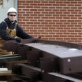 Michael Bisbee, with Multi-Craft Contractors, shifts a section of structural steel as a co-worker us...