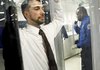  Tanner Suttles, left, a Transportation Security Administration employee is screened by a TSA officer during a demonstration of passenger screening technology, Wednesday, Dec. 30, 2009, at the TSA Systems Integration Facility in Arlington, Va. 