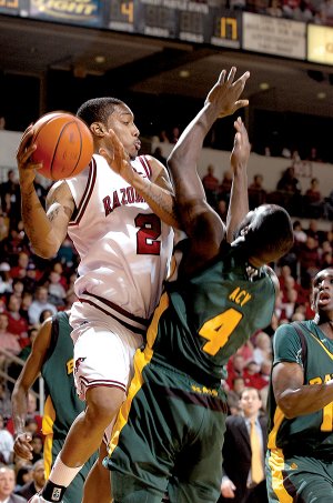 Arkansas' Jemal Farmer (2) bumps into Baylor's Quincy Acy (4) as he tries to pass the ball during the Baylor v. UA game Wednesday night at Verizon Arena in North Little Rock.