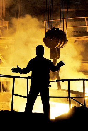 A steelworker labors at a mill in Shenyang in northeast China’s Liaoning province in June.