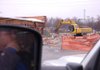 Capt. Tony Grimes watches as Bentonville’s old Fire Station No. 1, at 215 S.W. “A” St., is demolished Wednesday. The city plans to build an activity center on the property to open in March 2011.