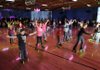 katers dance to “YMCA” on Wednesday on the opening night of the Starlight Skatium in Fayetteville. This is the first skating rink in Fayetteville since 2005.