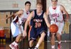 Rogers Heritage’s Brandon Brzozkiewicz, center, drives past Webb City, Mo., defenders Dillon Wales, left, and Austin Daniel on Wednesday at the 55th annual Neosho Holiday Classic in Neosho, Mo.
