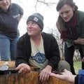 Damian Thompson shows a worm habitat to Rachel Schichtl (left) and Emily English of the Delta Garden...