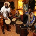 Kouakou Yao of Eureka Springs, left, smiles as Jo Ann Kaminsky and Jen Claude Lessou of Austin, Texa...