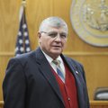 Truman Brewer, investigator for the Springdale city attorney, stands for a portrait in the courtroom...
